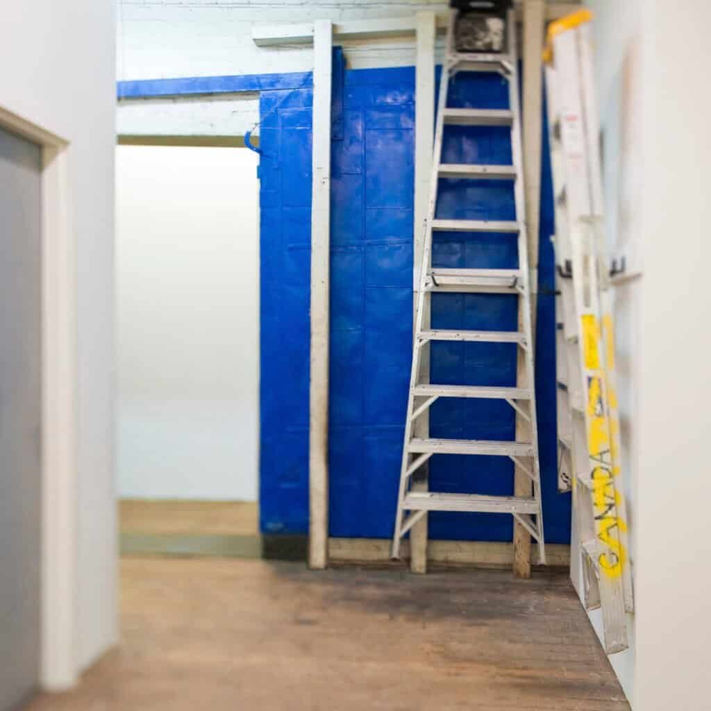 Precision ladder and scaffolding setup for interior painting at Central Coast Painter Corp. Expert painters preparing walls for a flawless paint job.