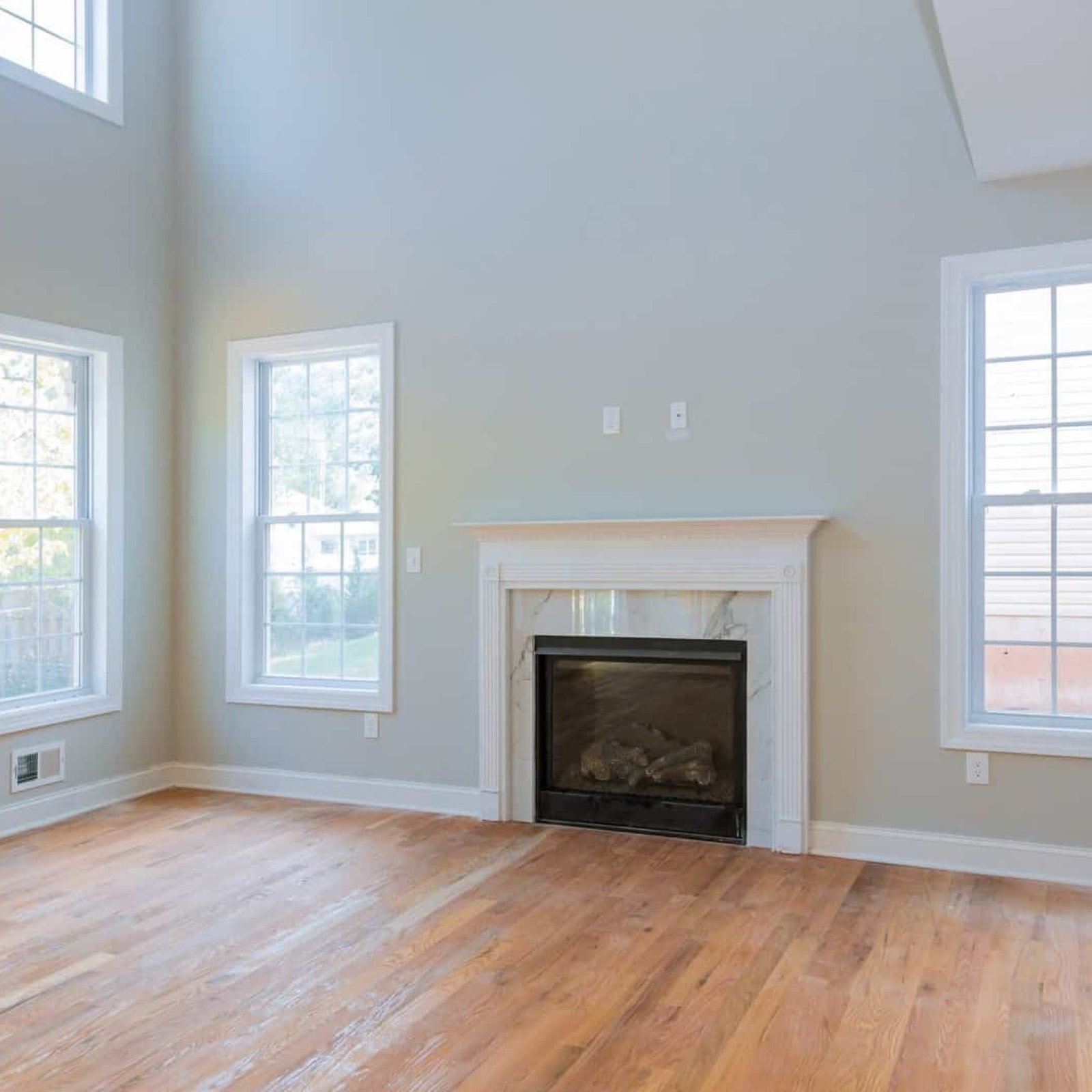 Interior new house construction fireplace in light room new apartment